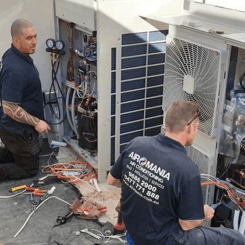 Airomania technician completing an air conditioning installation